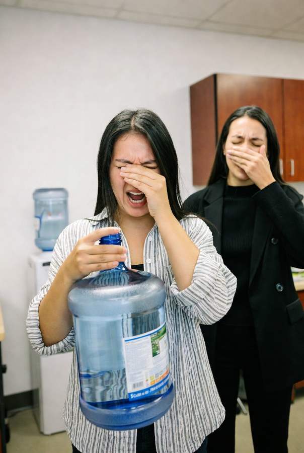 smelly 5 gallon water jug being cleaned in the office
