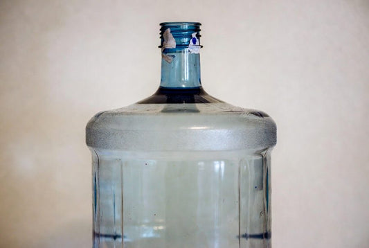 hard water stuck in 5 gallon water jug