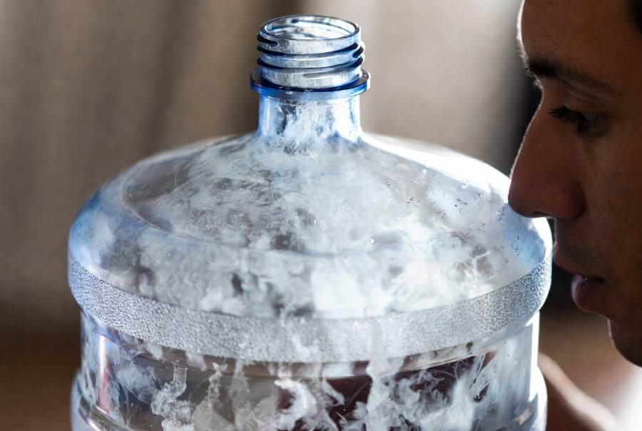 cloudy dirty water jug for water dispenser needs to be cleaned