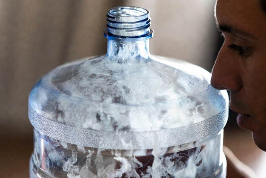 cloudy dirty water jug for water dispenser needs to be cleaned