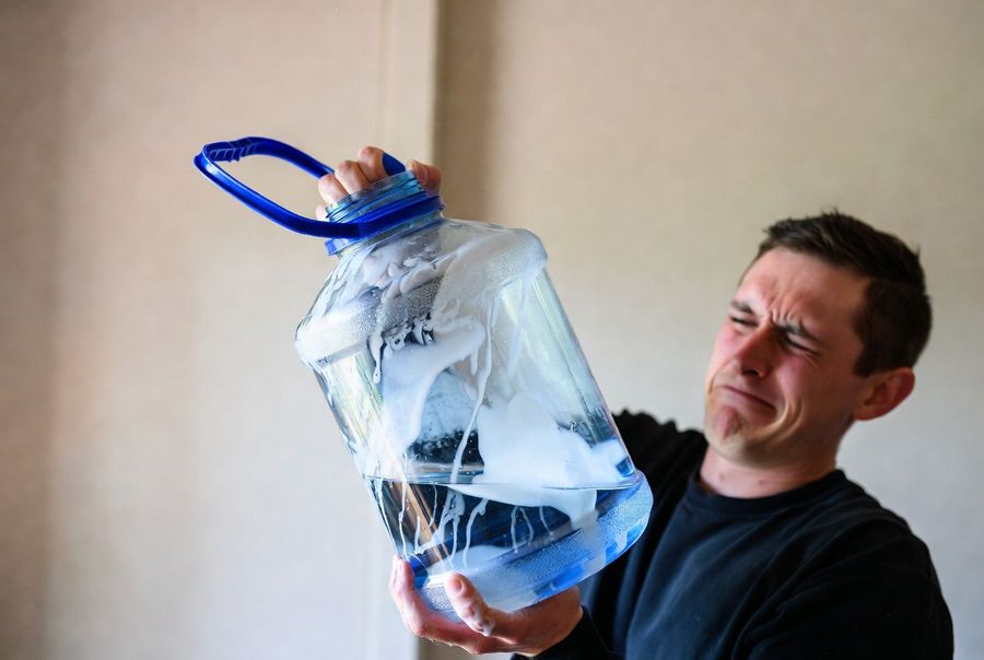 water jug damaged over time from cleaning incorrectly with bleach and vinegar