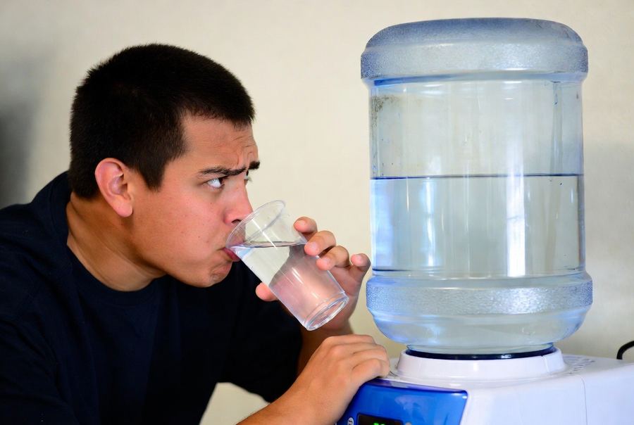 person not sure if commercial water cooler jug is clean