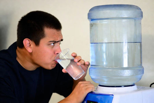 person not sure if commercial water cooler jug is clean