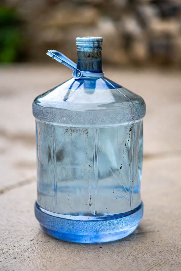dirty 5 gallon water jug that needs a cleaning schedule